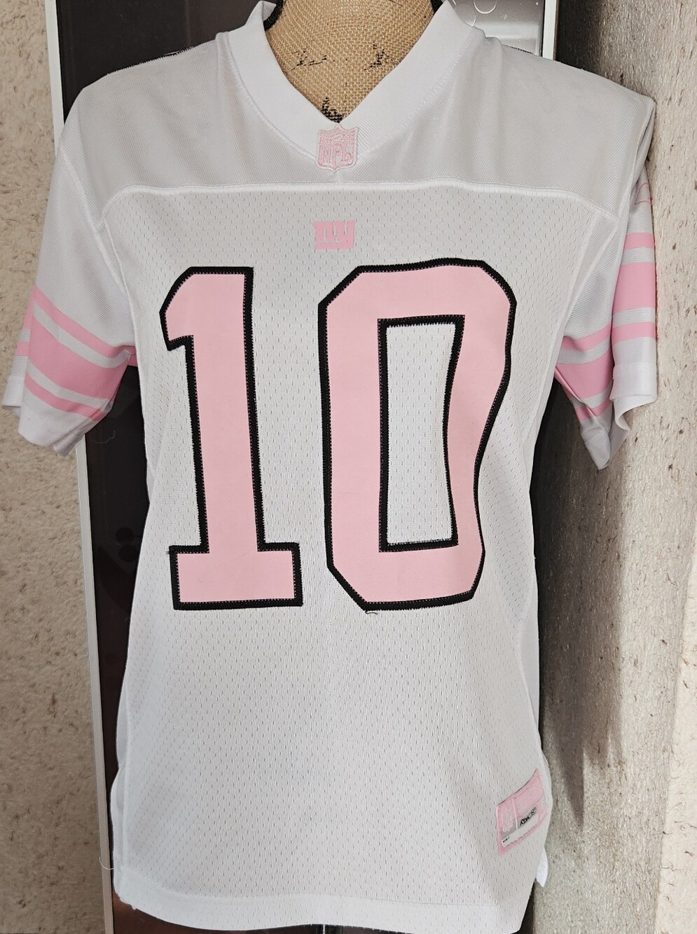 White & Pink #10 Football Jersey. Manning